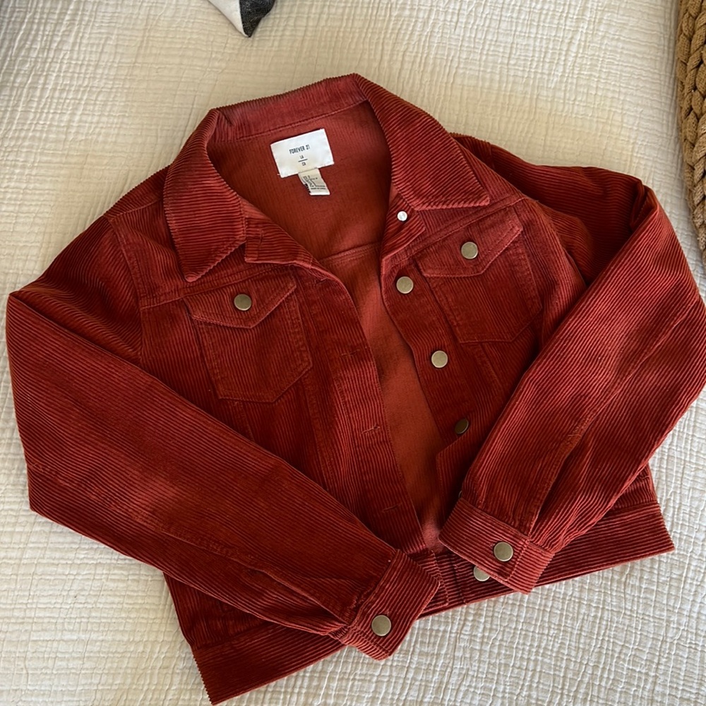Rust cropped corduroy jacket with brass button detail. Size S.